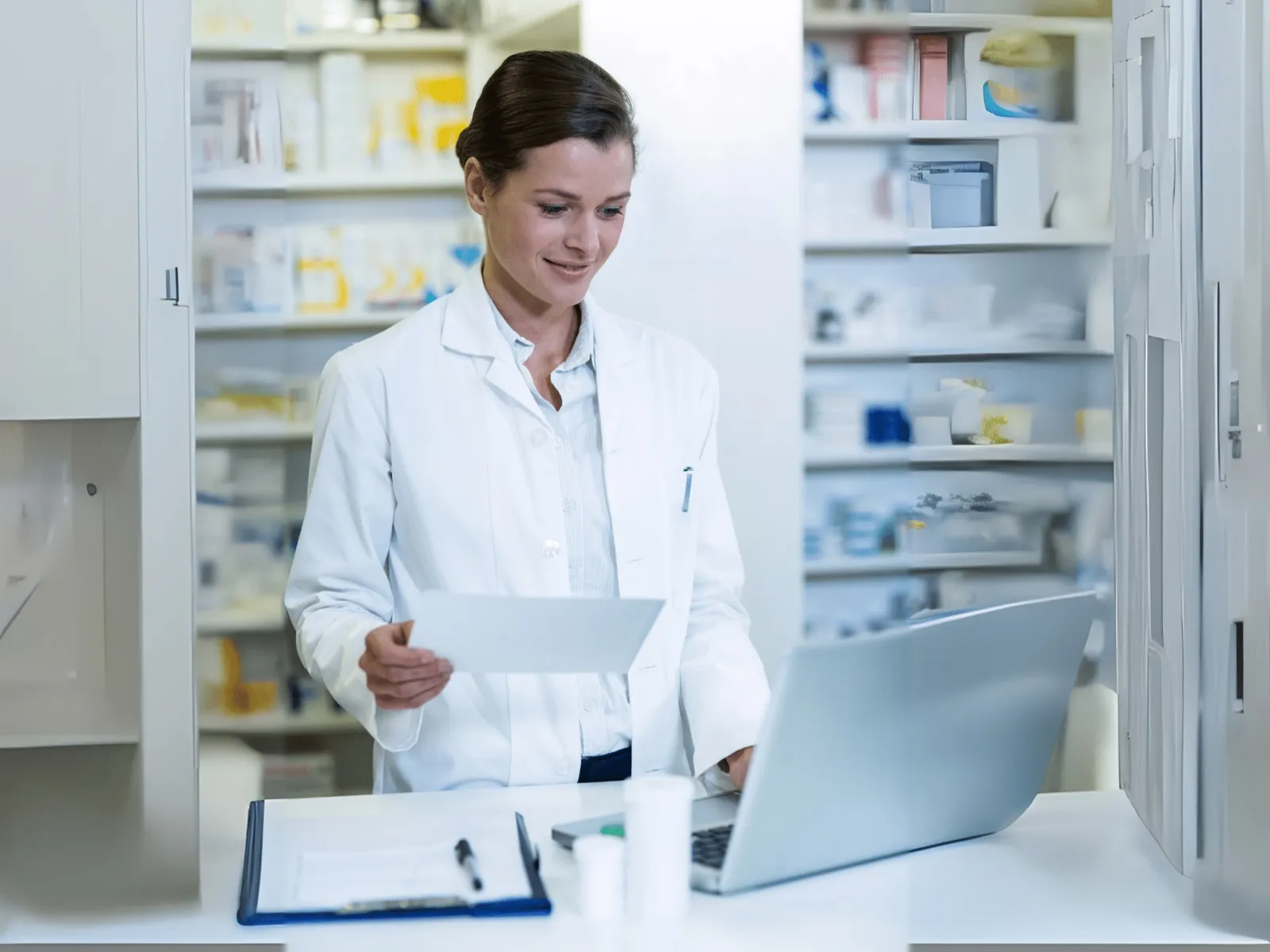 Pharmacist reviewing claims data on a laptop