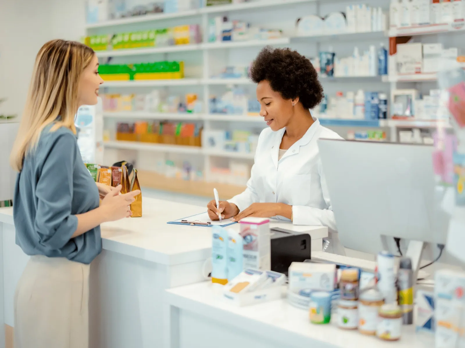 Pharmacist helping a customer at the pharmacy counter